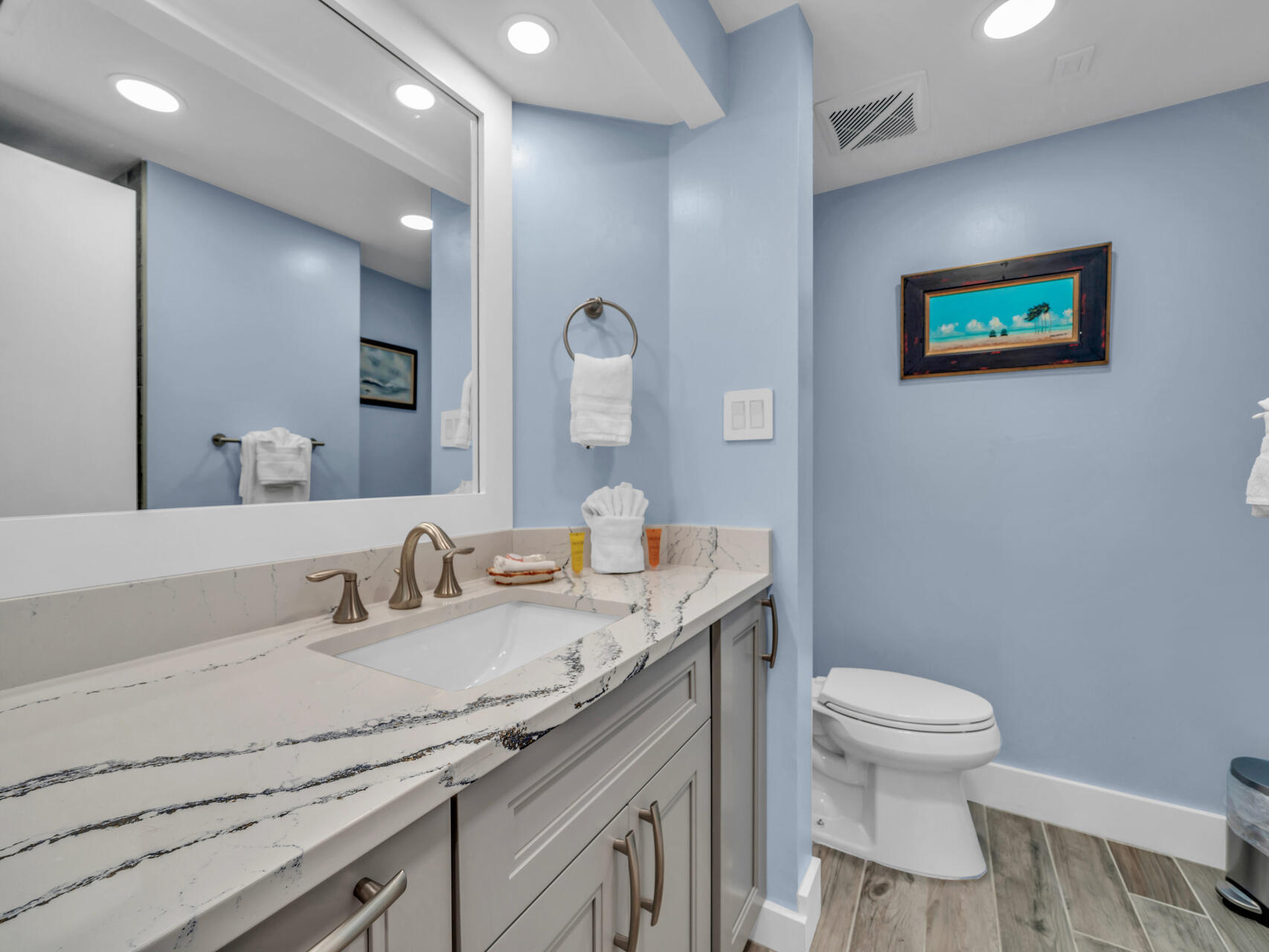 1096 Scenic Gulf Drive, Unit 1401/1401A Miramar Beach, FL 32550 - Photo 8 of 77 a bathroom with a granite countertop toilet sink and mirror