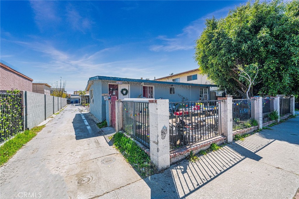 1414 West 224th Street Torrance, CA 90501 - Photo 1 of 12 a front view of a house with garden