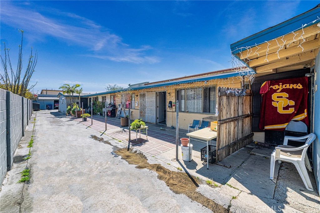 1414 West 224th Street Torrance, CA 90501 - Photo 2 of 12 a view of a patio with a table and chairs and potted plants