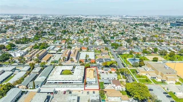 an aerial view of residential building and parking space