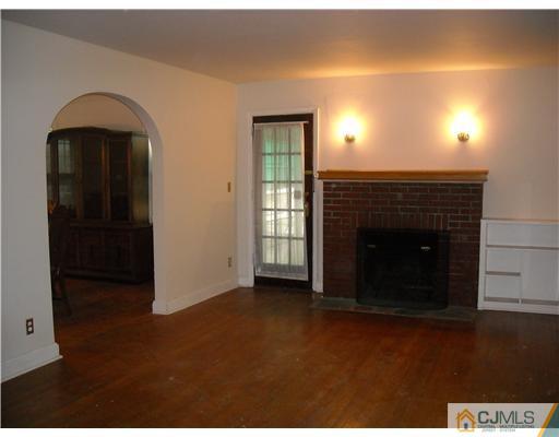 400 Bound Brook Road Middlesex, NJ 08846 - Photo 2 of 11 a view of an empty room with window and fire place