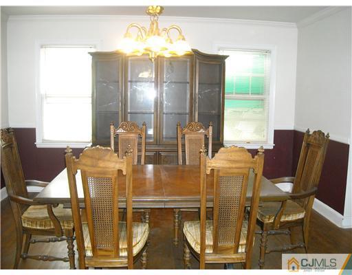 400 Bound Brook Road Middlesex, NJ 08846 - Photo 6 of 11 a view of a dining room with furniture and chandelier