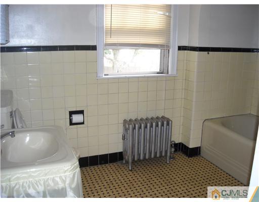 400 Bound Brook Road Middlesex, NJ 08846 - Photo 9 of 11 a bathroom with a sink and a bathtub
