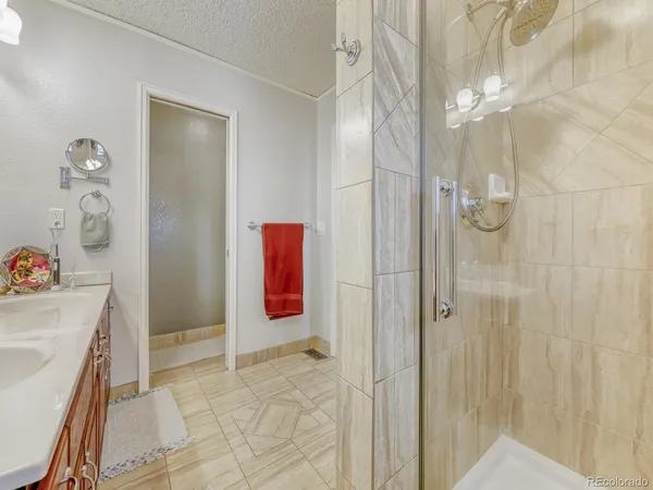 a bathroom with a tub and shower