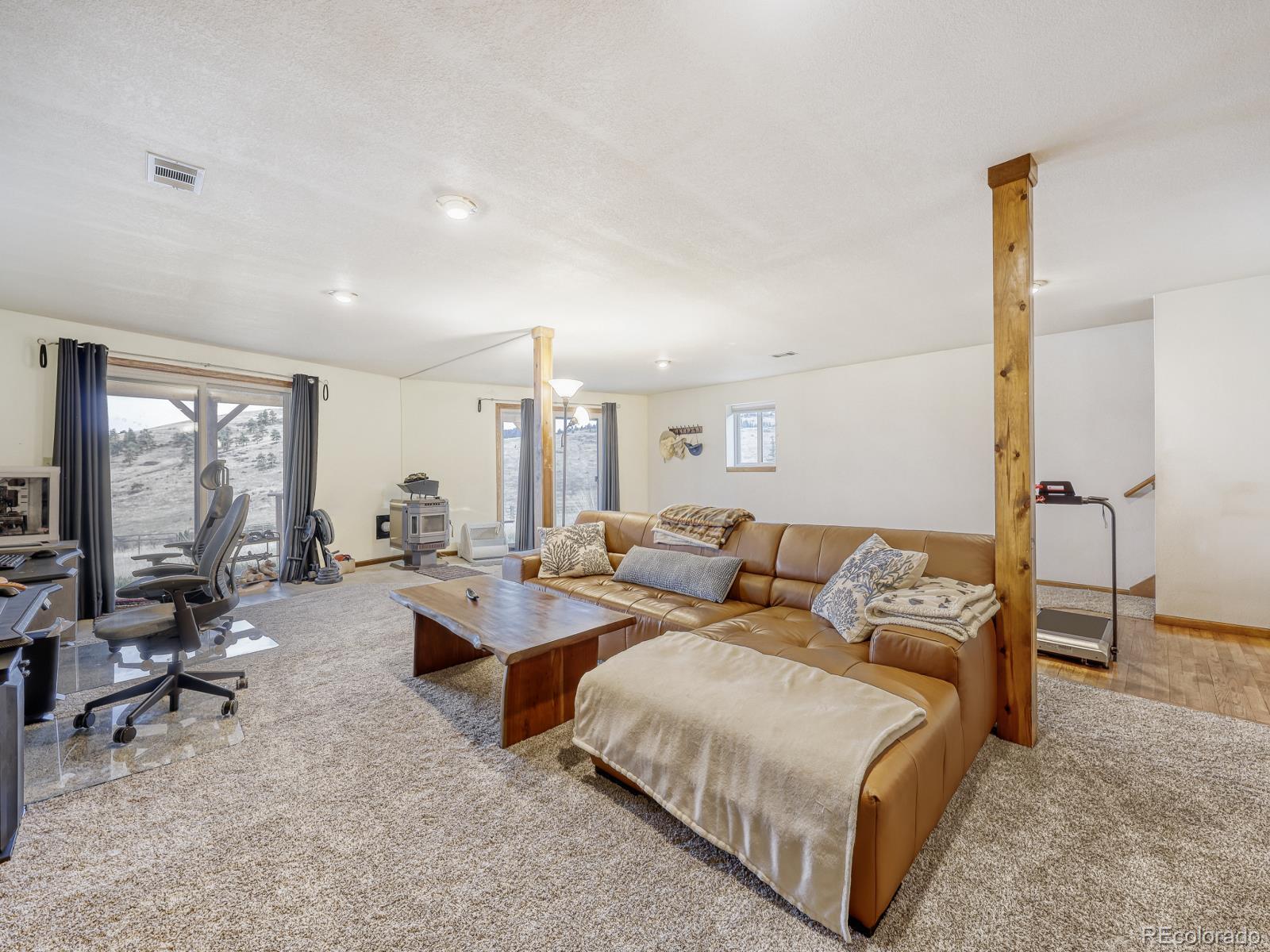 32020 Robinson Hill Road Golden, CO 80403 - Photo 23 of 28 a living room with furniture and a large window