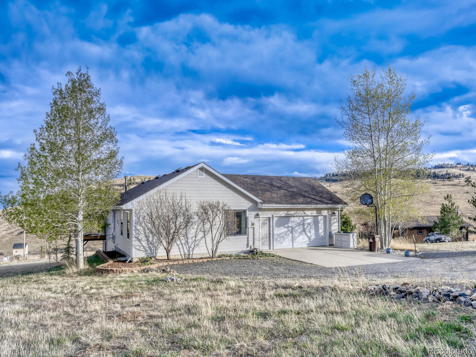 32020 Robinson Hill Road Golden, CO 80403 - Photo 4 of 28 a view of a house with a yard