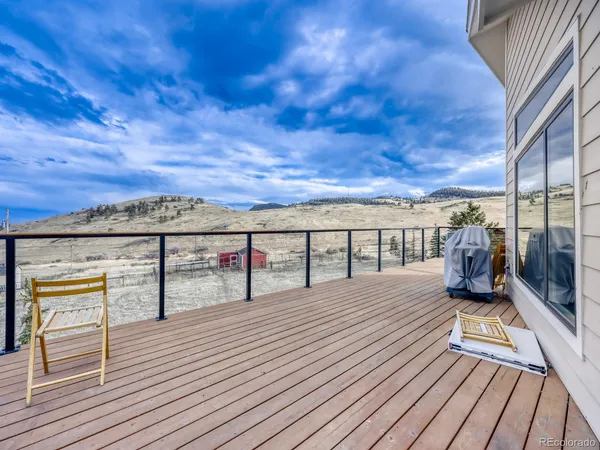 a view of roof deck with patio