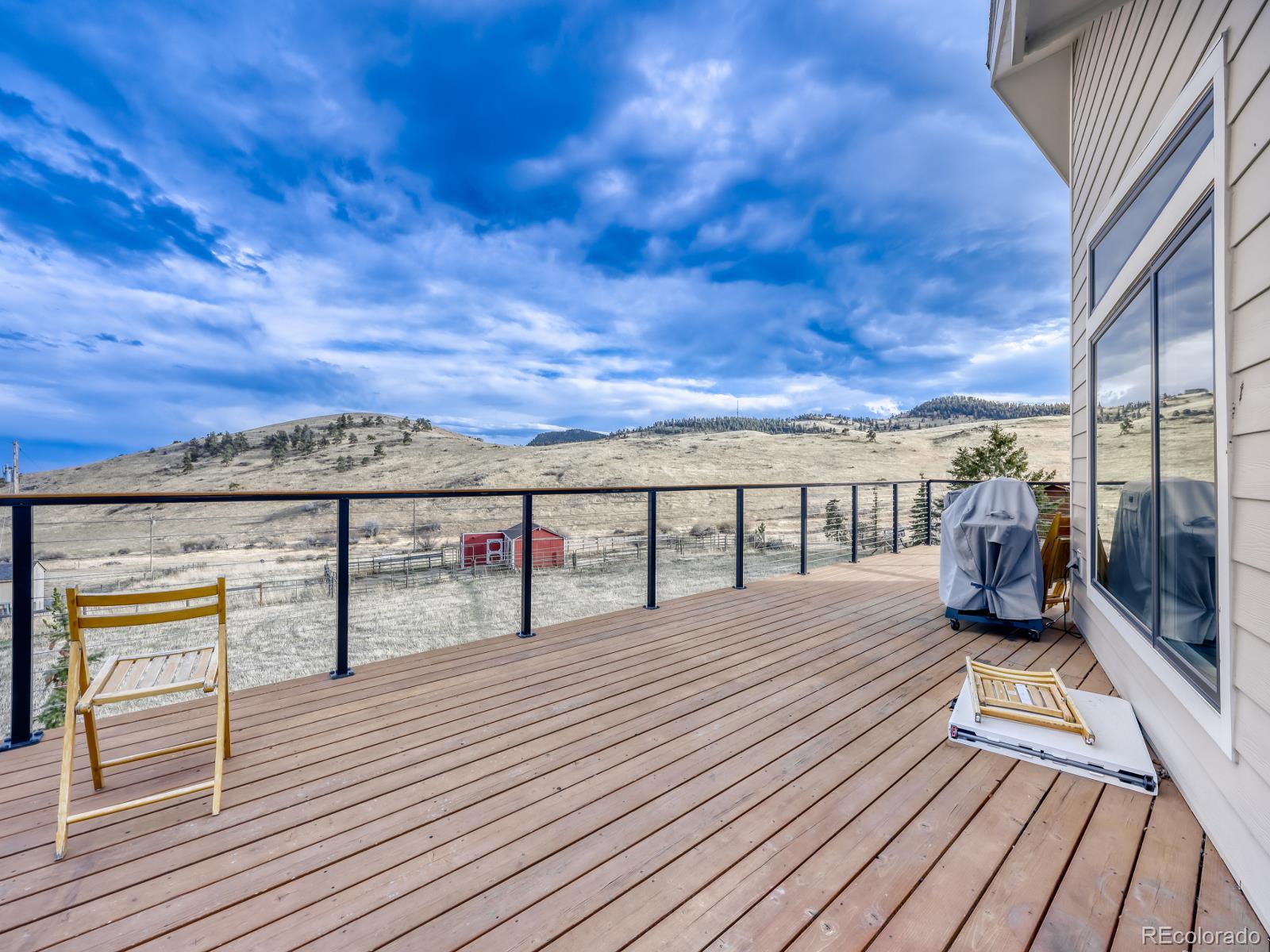 32020 Robinson Hill Road Golden, CO 80403 - Photo 5 of 28 a view of roof deck with patio