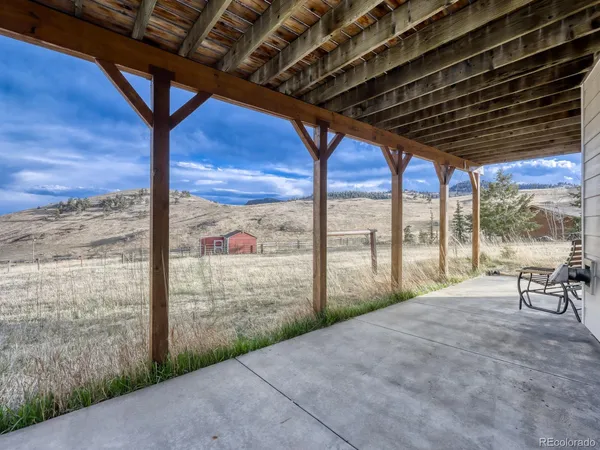a view of porch with green space