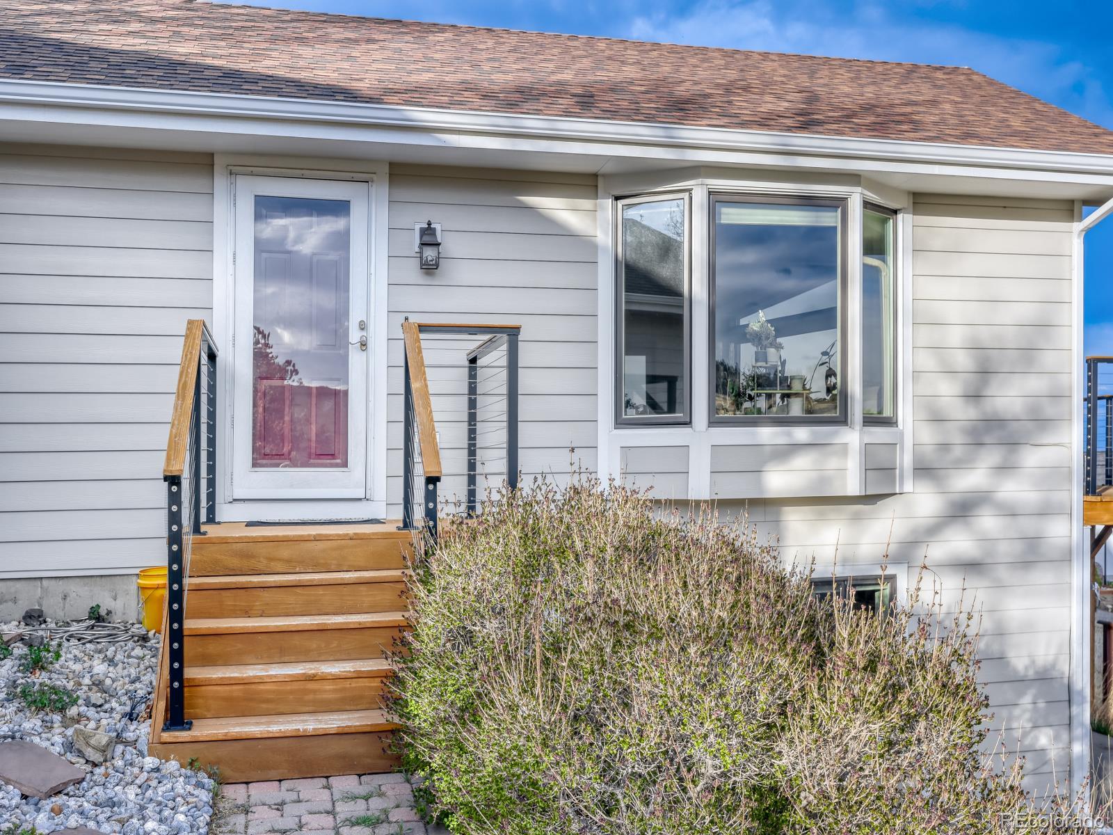 32020 Robinson Hill Road Golden, CO 80403 - Photo 7 of 28 a front view of a house with a yard