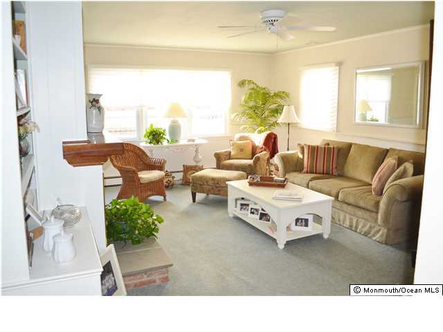 1417 Rue Mirador Point Pleasant, NJ 08742 - Photo 11 of 21 a living room with furniture and a large window