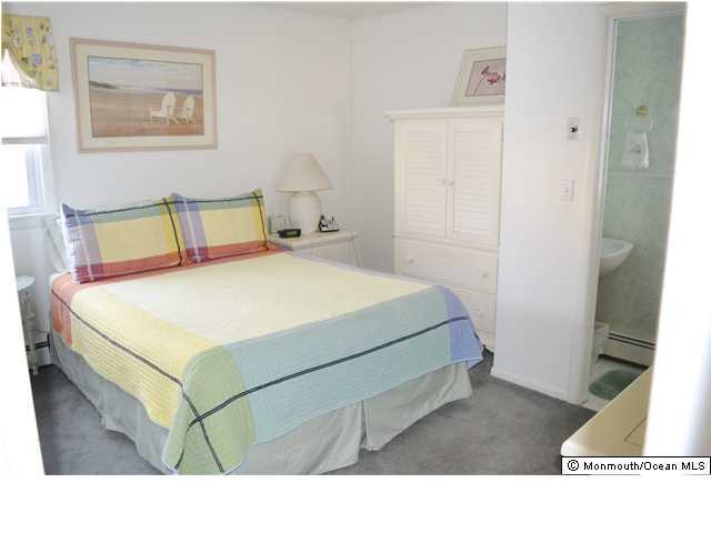 1417 Rue Mirador Point Pleasant, NJ 08742 - Photo 14 of 21 a bedroom with a bed and a night stand