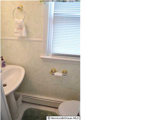 1417 Rue Mirador Point Pleasant, NJ 08742 - Photo 15 of 21 a bathroom with a toilet and a sink