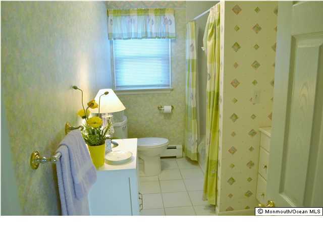 1417 Rue Mirador Point Pleasant, NJ 08742 - Photo 18 of 21 a bathroom with a sink and a mirror