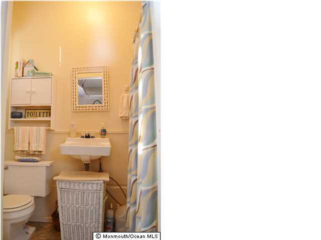 1417 Rue Mirador Point Pleasant, NJ 08742 - Photo 19 of 21 a view of a bathroom with a sink and a window