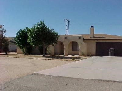 21195 Sitkan Road Apple Valley, CA 92308 - Photo 1 of 1 a street view with wooden fence