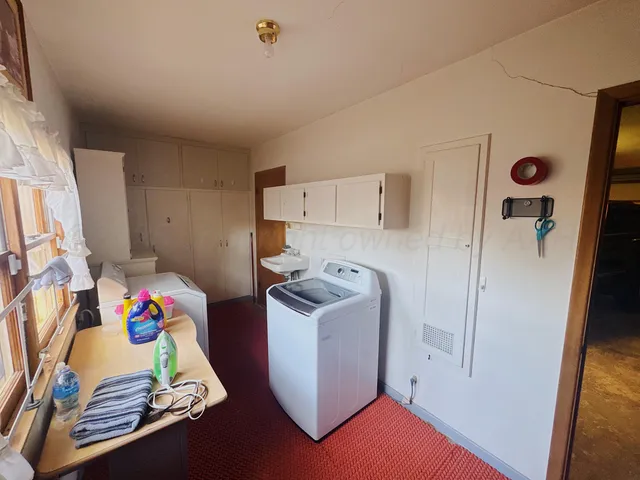 a view of a room with furniture and a swimming pool