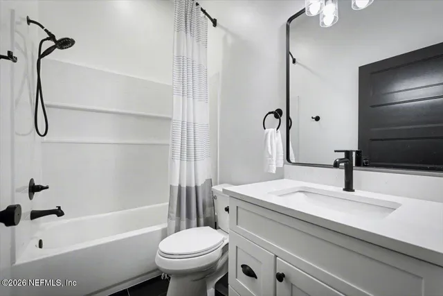 a utility room with sink dryer and washer