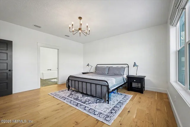 a bathroom with a bathtub and a window