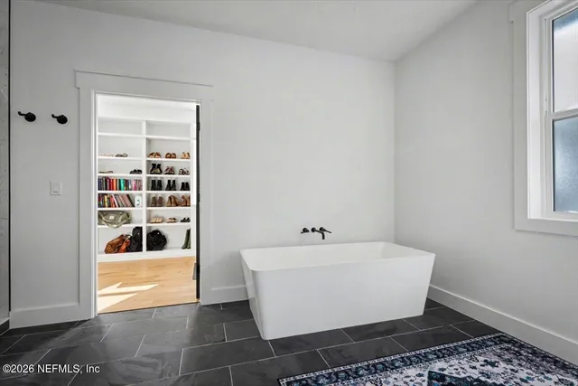 a view of a lake with houses in the back