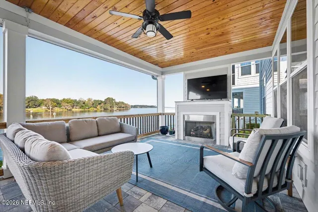 an aerial view of a house with a ocean view