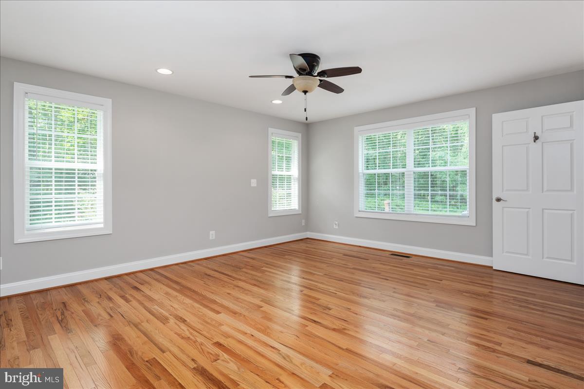 115 Rebel Road Grasonville, MD 21638 - Photo 13 of 37 Owner's Suite w/ HWD Floors, en suite bath & WIC