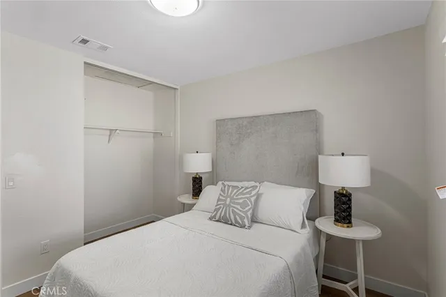 a bedroom with a bed and a table