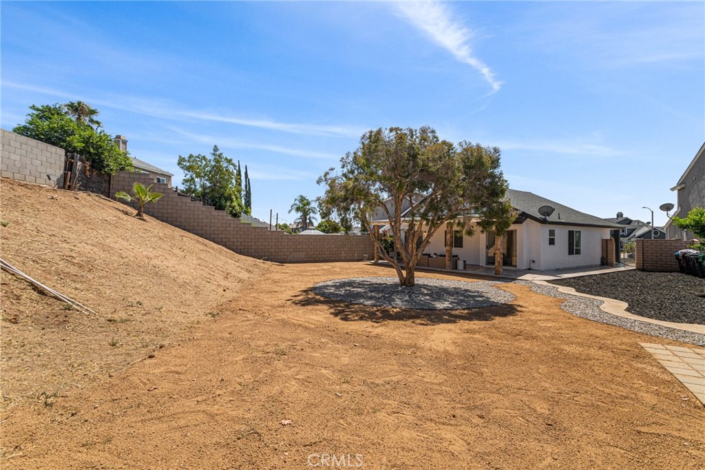 23020 Mansfield Lane Moreno Valley, CA 92557 - Photo 21 of 28 a front view of a house with a yard