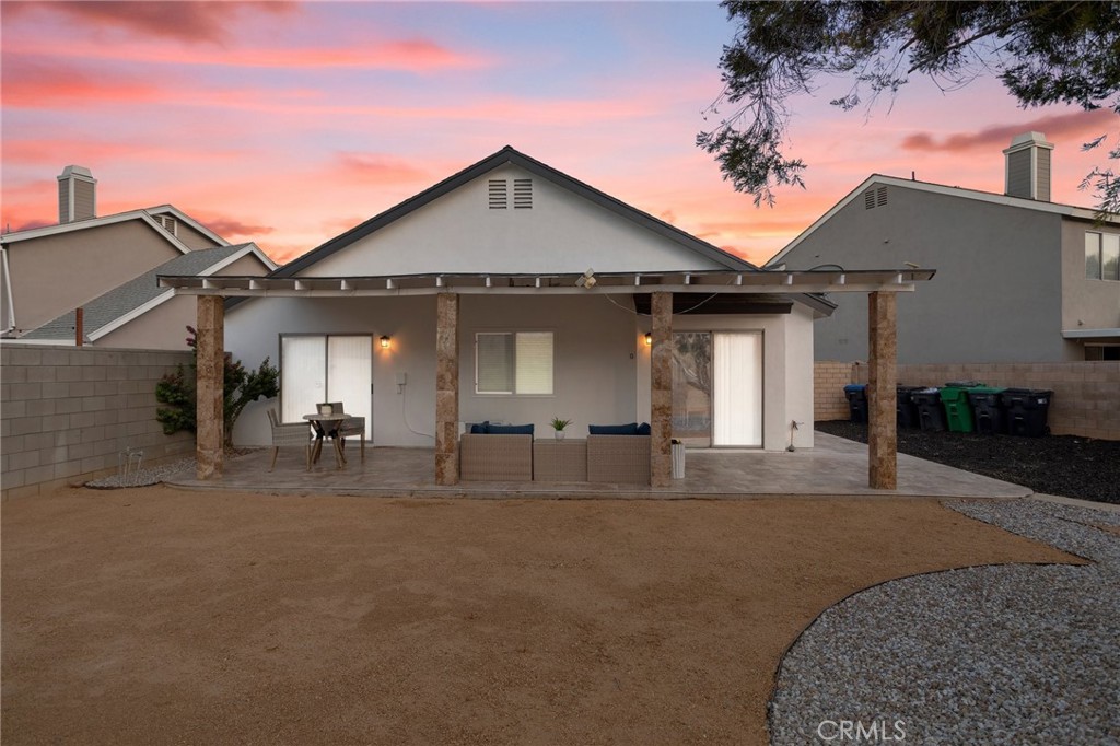 23020 Mansfield Lane Moreno Valley, CA 92557 - Photo 25 of 28 a front view of a house with yard and seating area
