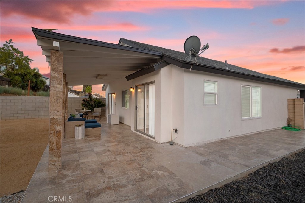 23020 Mansfield Lane Moreno Valley, CA 92557 - Photo 26 of 28 a view of a house with backyard and sitting area