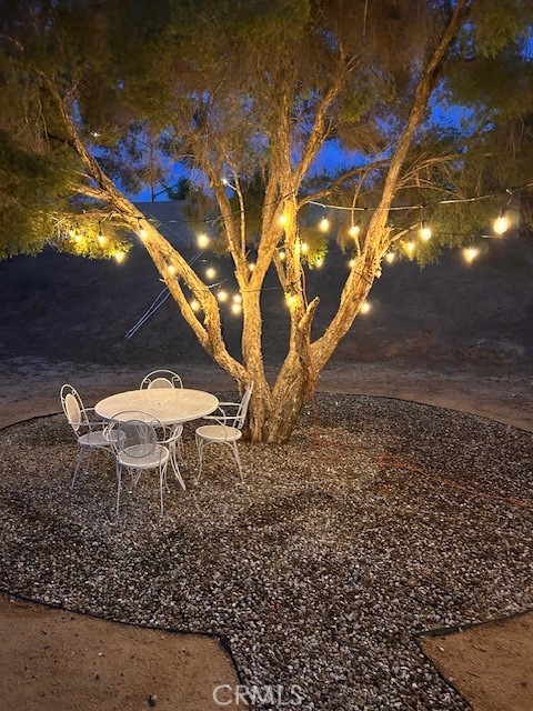 23020 Mansfield Lane Moreno Valley, CA 92557 - Photo 27 of 28 a backyard of a house with table and chairs