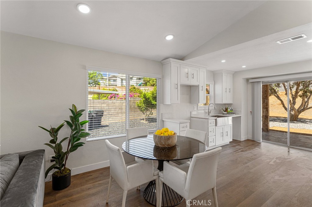 23020 Mansfield Lane Moreno Valley, CA 92557 - Photo 4 of 28 a kitchen with a table and chairs in it