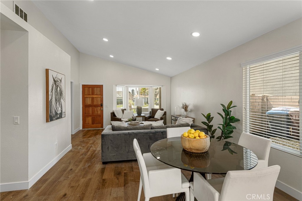 23020 Mansfield Lane Moreno Valley, CA 92557 - Photo 5 of 28 a view of a dining room with furniture window and wooden floor