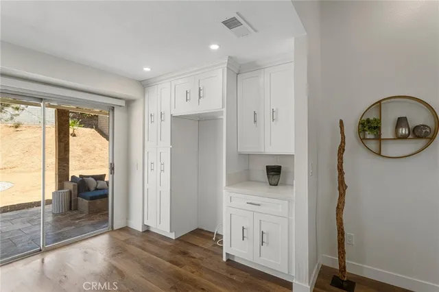 a view of hallway with livingroom and furniture
