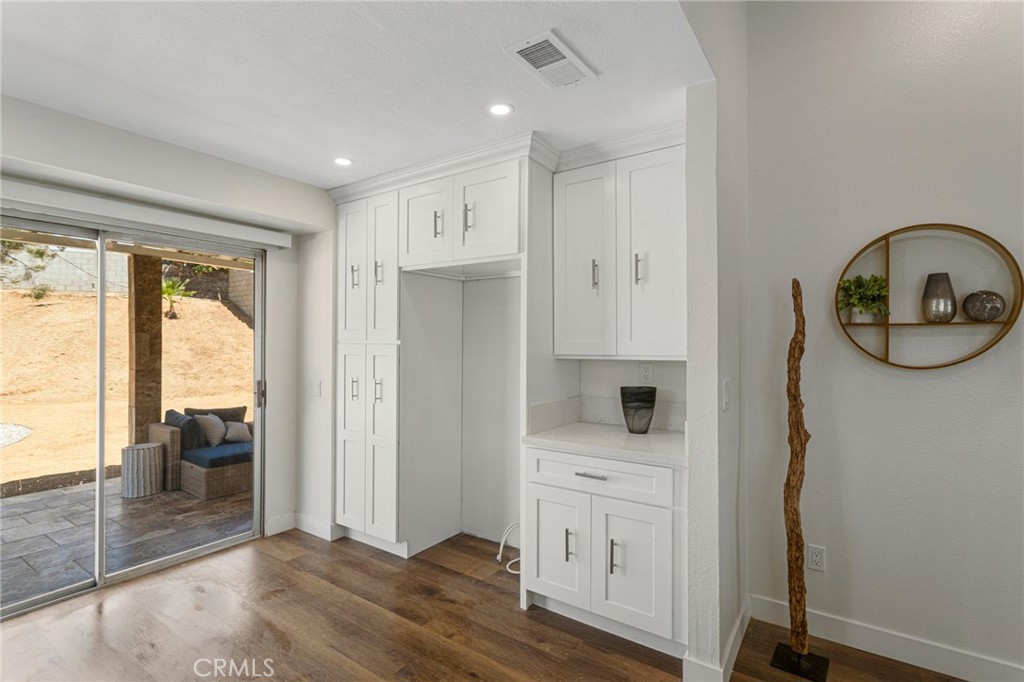 23020 Mansfield Lane Moreno Valley, CA 92557 - Photo 7 of 28 a view of hallway with livingroom and furniture