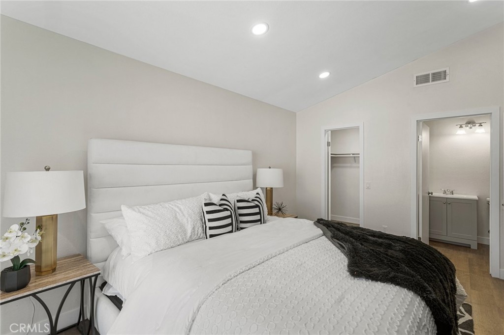 23020 Mansfield Lane Moreno Valley, CA 92557 - Photo 10 of 28 a bedroom with a bed and a lamp