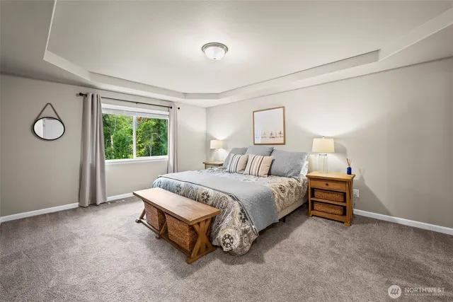 a bed room with a bed and a lamp