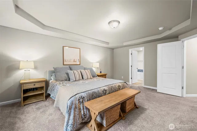 a spacious bathroom with a double vanity sink and a mirror