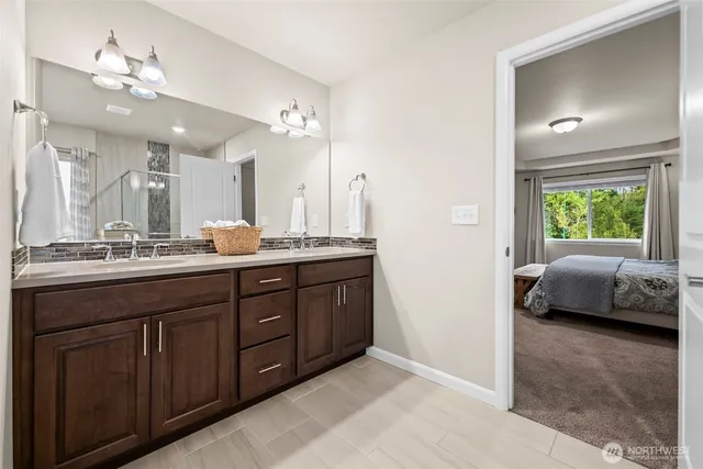a bathroom with a tub and a shower