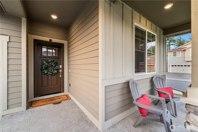 a view of a chair and tables in the patio