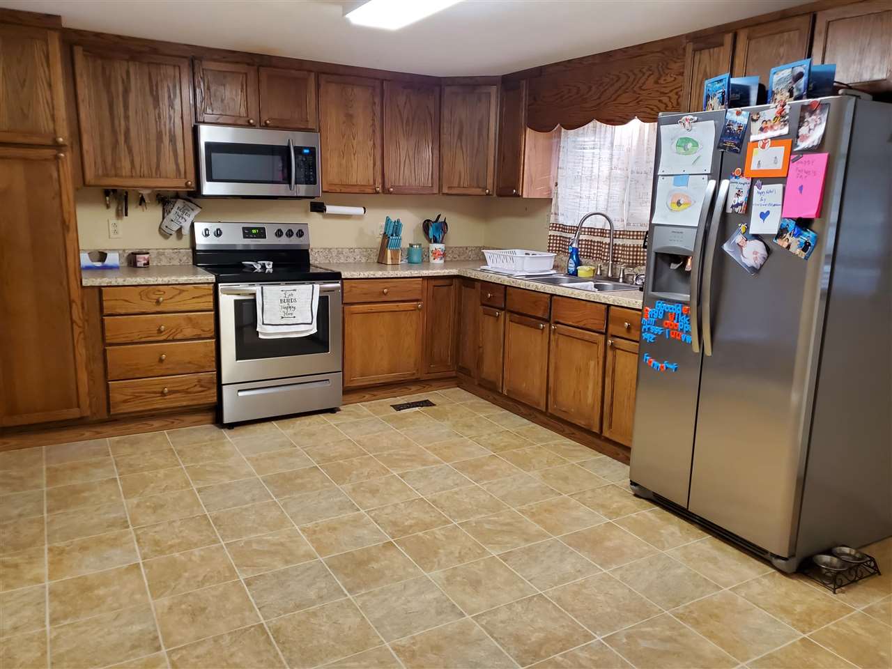 39 Clark Lane Ripley, TN 38063 - Photo 4 of 10 a kitchen with stainless steel appliances granite countertop a refrigerator and a stove top oven