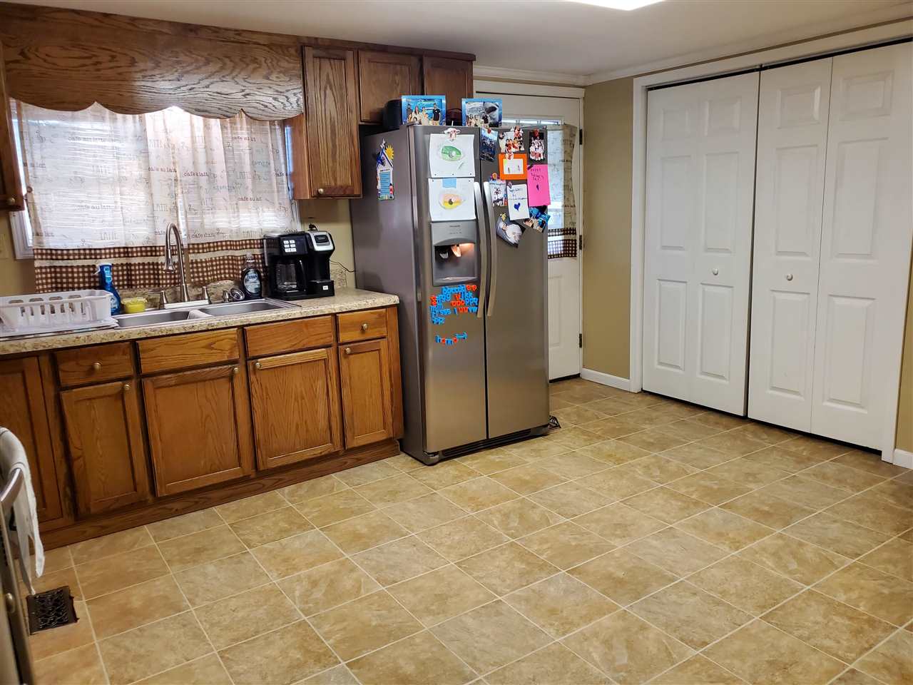 39 Clark Lane Ripley, TN 38063 - Photo 5 of 10 a view of a kitchen with refrigerator and window