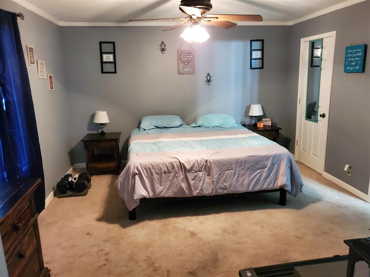 39 Clark Lane Ripley, TN 38063 - Photo 6 of 10 a bedroom with a bed and wooden floor
