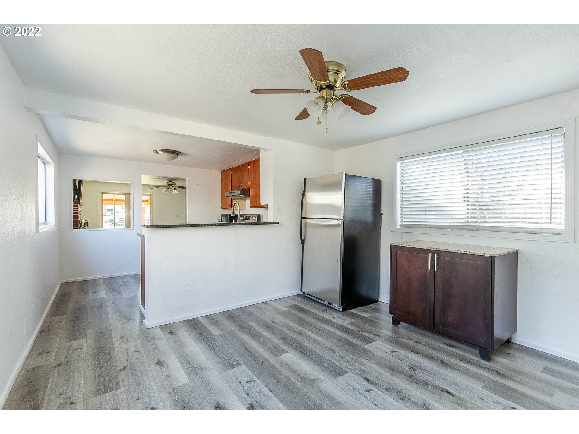 1158 D Street Springfield, OR 97477 - Photo 11 of 24 a view of an empty room with window and wooden floor