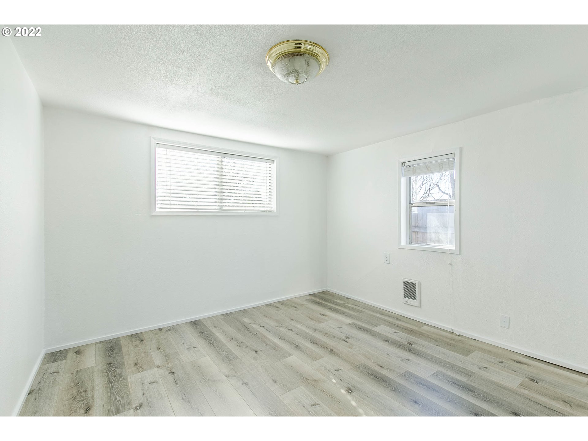 1158 D Street Springfield, OR 97477 - Photo 13 of 24 a view of an empty room with window and closet area