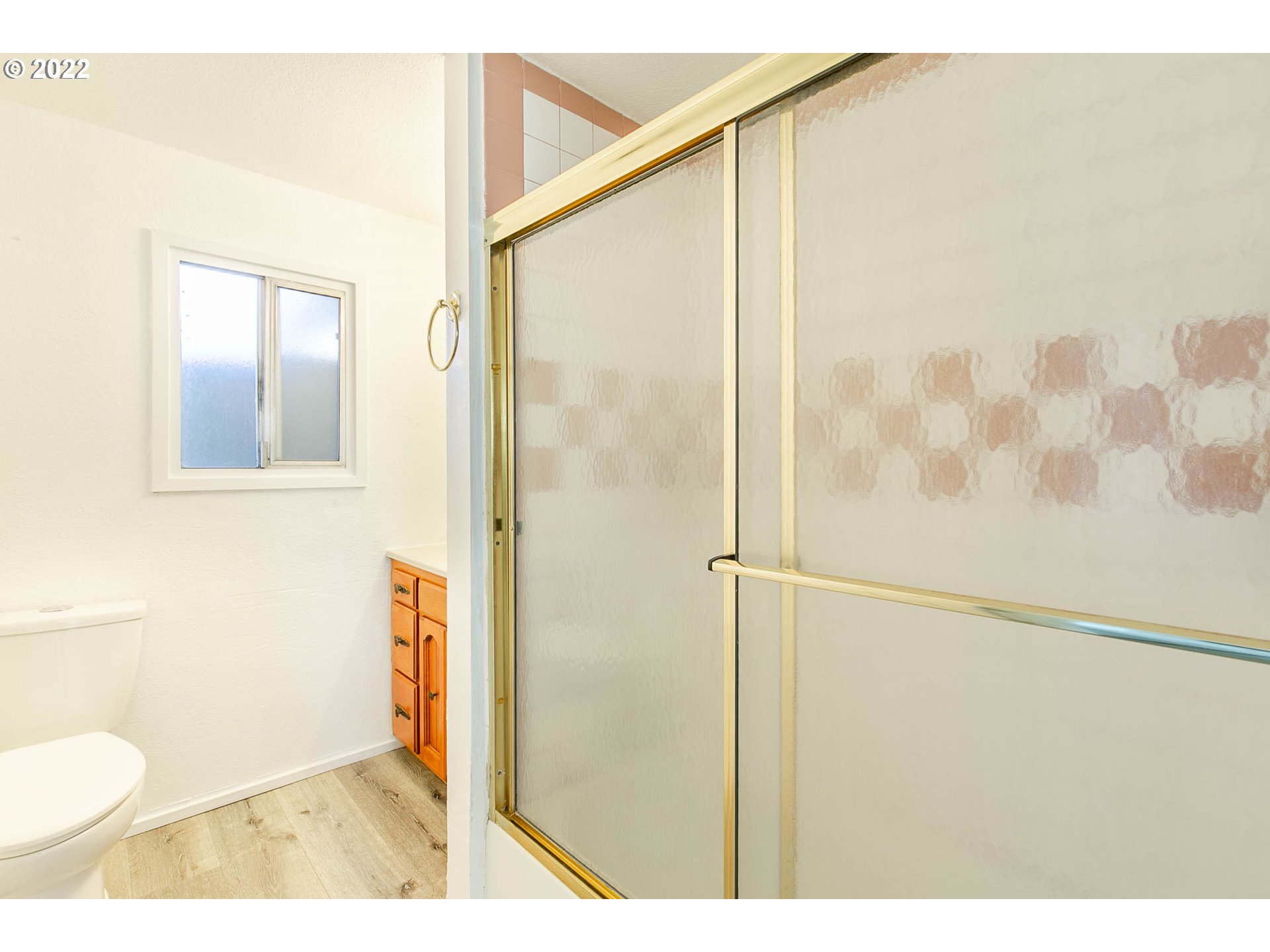 1158 D Street Springfield, OR 97477 - Photo 15 of 24 a bathroom with a shower and a toilet