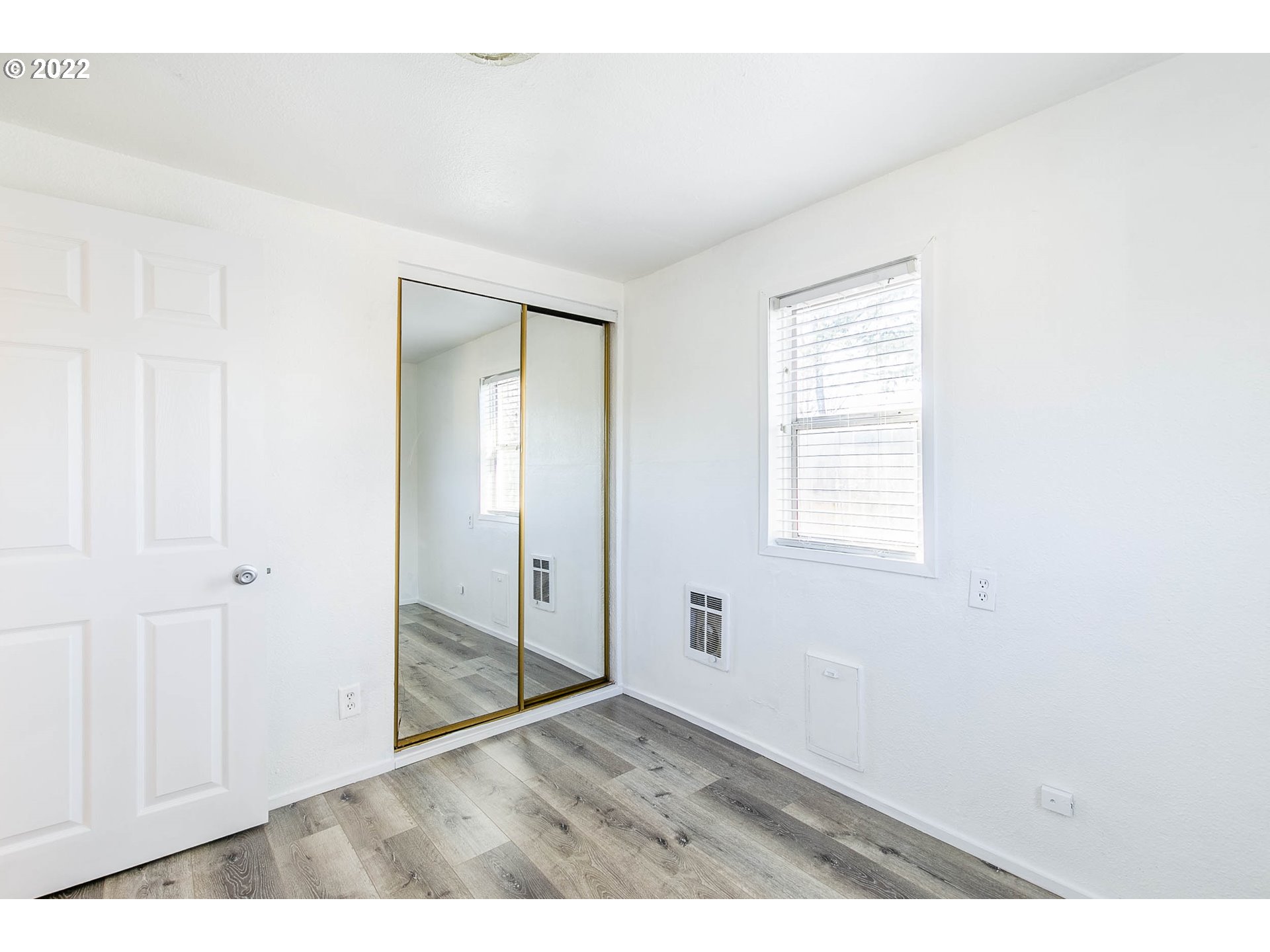 1158 D Street Springfield, OR 97477 - Photo 18 of 24 a view of an empty room with wooden floor