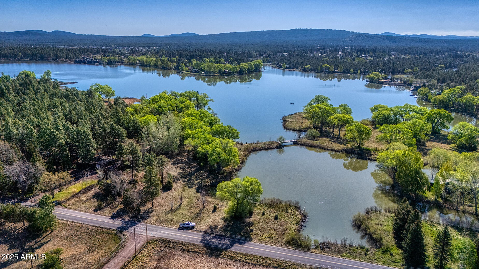 a view of a lake with a mountain and a lake view