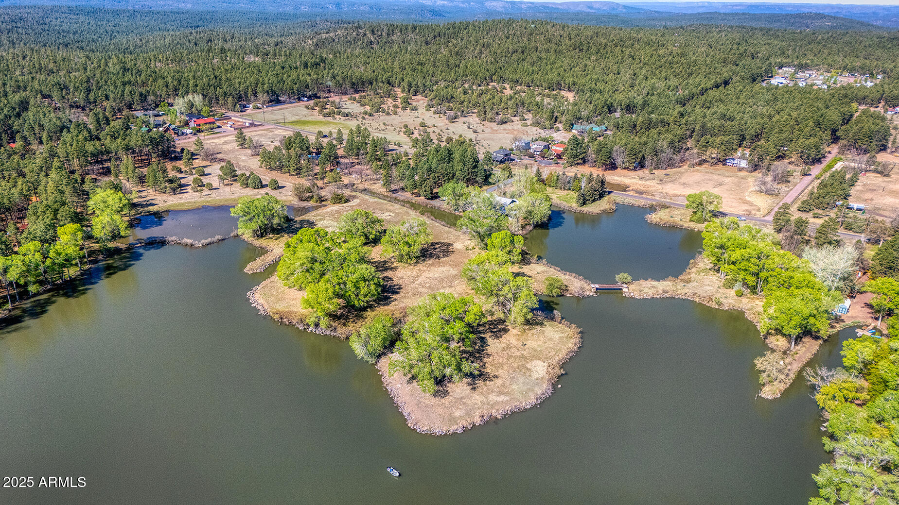 Pinetop-lakeside Larson Road Lakeside, AZ 85929 - Photo 12 of 45 an aerial view of a house with a lake view