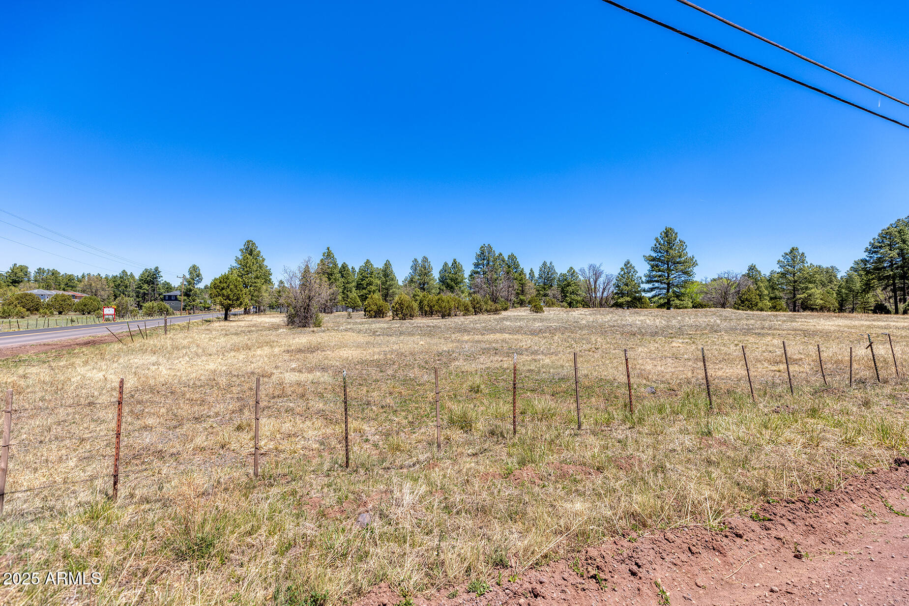 Pinetop-lakeside Larson Road Lakeside, AZ 85929 - Photo 27 of 45 a view of a lake with houses in the background